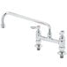 A chrome T&S deck-mounted faucet with two lever handles.