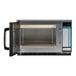 A Sharp heavy-duty commercial stainless steel microwave with the door open.