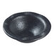 A black round Solia porcelain mini dish.