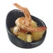 A Solia black porcelain mini dish filled with shrimp and orange slices.