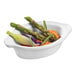A Solia white porcelain mini dish filled with asparagus and carrots.