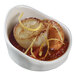 A white porcelain Solia mini dish with tortellini.