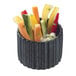 A Solia black fluted porcelain mini dish filled with vegetables and dip on a table.