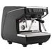 A black and silver Nuova Simonelli Appia Life 1 Group Volumetric Espresso Machine with two coffee cups on top.