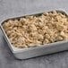 A metal pan filled with Beyond Meat plant-based vegan chicken pieces.