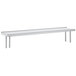 A stainless steel Advance Tabco rear mounted table overshelf with a shelf on top.