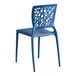 A blue resin side chair with a webbed back design.