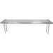 A white rectangular stainless steel shelving unit with rear turn-up on a long silver table.