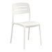 A white resin side chair with a slat back design.
