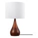 A table lamp with a two-tone faux wood base and a white cotton shade.