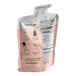 A close-up of a Numilk Barista Cashew Milk Concentrate pouch.