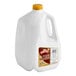 A jug of Turkey Hill Chocolate Soft Serve Ice Cream Mix with a yellow cap and a label on a white background.