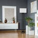 A 58-inch matte black floor lamp with a white linen shade and an on/off socket rotary switch.