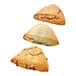 Three triangular scones with chocolate chips on top.