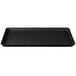 A black rectangular MFG Tray on a counter.