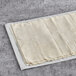 A stack of Kontos fillo dough sheets on a white surface.