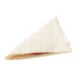 A triangular white turnover with cherry filling and a strawberry on top.