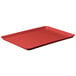 A red rectangular MFG Tray on a counter.
