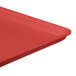 A close up of a red MFG Tray fiberglass market display tray.