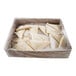 A plastic bag of trays filled with cherry turnover dough.