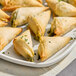 A plate of small appetizers made with Kontos Fillo Dough on a white table.
