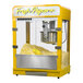 A yellow Paragon countertop popcorn machine with a yellow lid.
