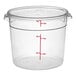 A clear round polycarbonate food storage container with a lid and measurement markings up to 6 quarts or 6 liters.