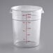A clear round polycarbonate food storage container with a lid and red measurement markings up to 22 quarts.