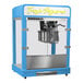A blue and silver Paragon Zenith countertop popcorn machine.