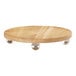 An oak wood round display stand with silver balls on top.