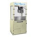 A Paragon cream popcorn machine on a metal cabinet with a glass front.
