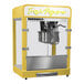 A yellow Paragon Zenith countertop popcorn machine with a silver lid.