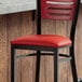 A red vinyl padded seat for metal frame seating.