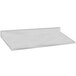 A stainless steel countertop with a stainless steel backsplash.