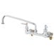 A T&S chrome wall mount faucet with two handles.