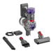 A Dyson Car+Boat cordless hand vacuum with a red handle.