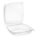 A clear hinged PET plastic clamshell container with a lid open.