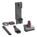 A Dyson V8 cordless stick vacuum, battery, charger, and tool kit on a counter.