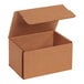 A Lavex Kraft Tuck Top corrugated mailer box with an open lid.