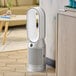A white and silver Dyson Purifier Hot+Cool on a floor.