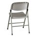 A gray contoured injection-molded folding chair with a charcoal frame and gray legs.