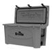 A grey Grizzly Cooler with a lid open and black handles.