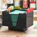 A black Choice 3-compartment bar caddy with napkins and straws.