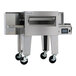 A stainless steel Lincoln Aperion conveyor oven with a wide belt and caster wheels.