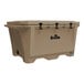 A large tan Grizzly Cooler with black handles.