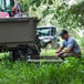 A man pouring water from a Grizzly Cooler into a container.