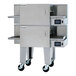 A double stacked stainless steel electric conveyor oven with two wide belts and digital controls, mounted on wheels.