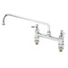 A T&S chrome deck-mounted pantry faucet with two handles and a swing nozzle.