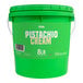 A close up of a green Vor pistachio cream pail with a white label.
