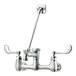A silver Krowne Royal Series wall-mount faucet with wristblade handles and a service sink nozzle.